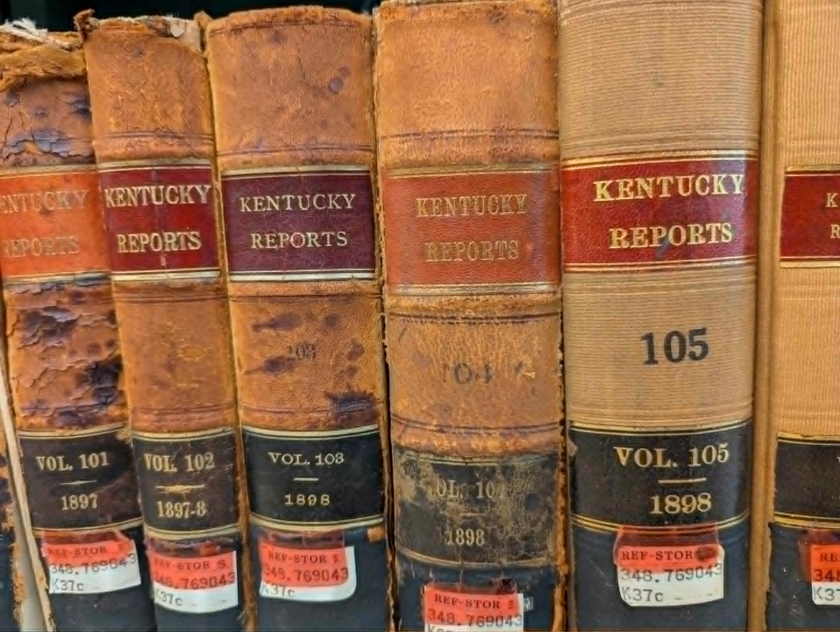 Close-up of worn, leather-bound volumes of Kentucky Reports from the late 1800s